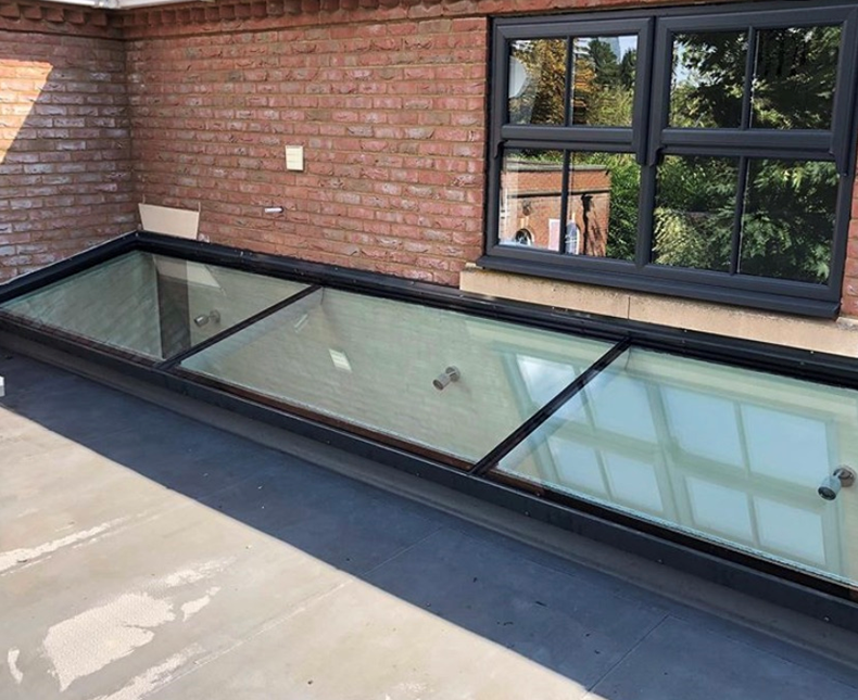 Flat rooflight shown on extension with wall abutment
