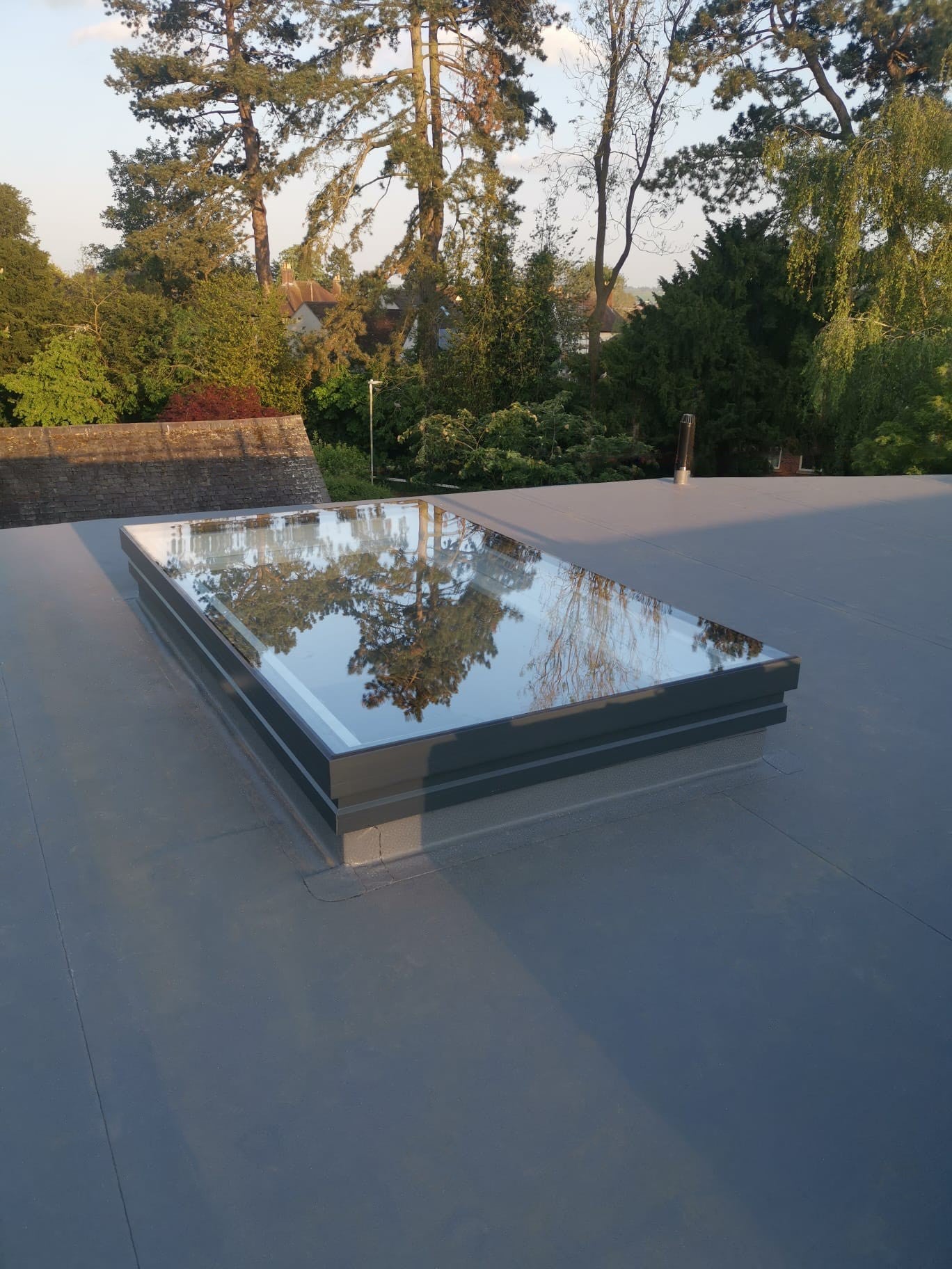 Astroglaze Flat Fixed Laminated Glass Rooflight shown installed on a roof